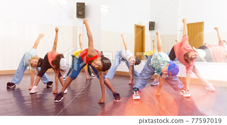 Kids training hip hop in dance studio 77597019