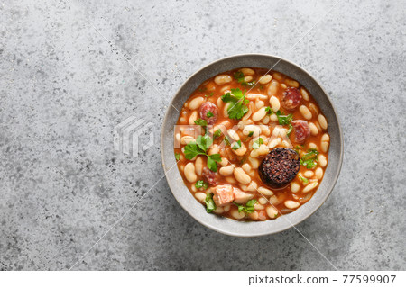 Spanish asturiana fabada on gray table. Copy space Spanish asturiana fabada on gray table. Copy space 77599907