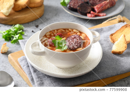 Spanish fabada on gray table. Copy space Spanish fabada on gray table. Copy space 77599908