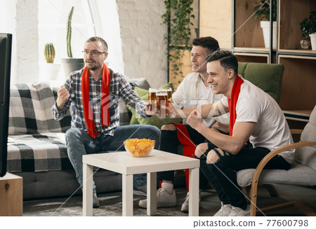 Group of friends watching sport match together. Concept of friendship, leisure activity, emotions 77600798