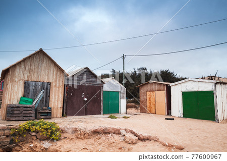 Coastal barns for boats are on the beach Coastal barns for boats are on the beach 77600967
