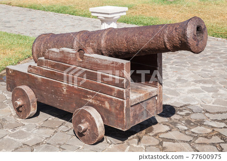 Ancient ship cannon, close-up photo 77600975