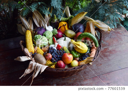 Basket of organic food vegetables 77601539