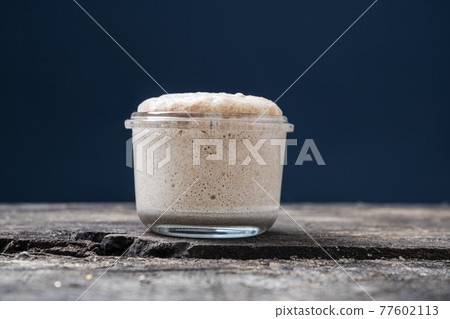 Heaping jar of sourdough starter yeast Heaping jar of sourdough starter yeast 77602113