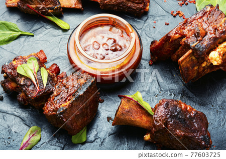 Roasted sliced barbecue beef ribs Roasted sliced barbecue beef ribs 77603725