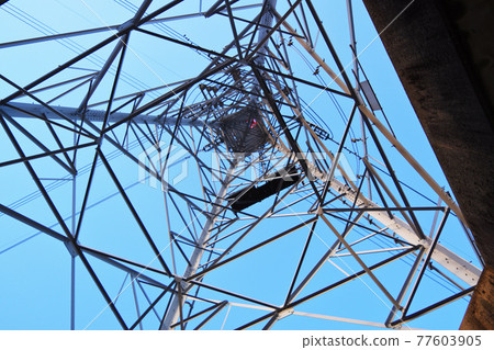 Steel tower and blue sky 77603905