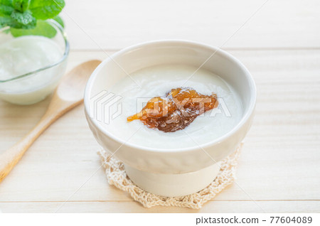 Rhubarb jam on yogurt Rhubarb jam on yogurt 77604089