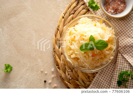 Pickled cabbage and carrots, probiotics source, healthy food. Fermented vegetables. Pickled cabbage and carrots, probiotics source, healthy food. Fermented vegetables. 77606106