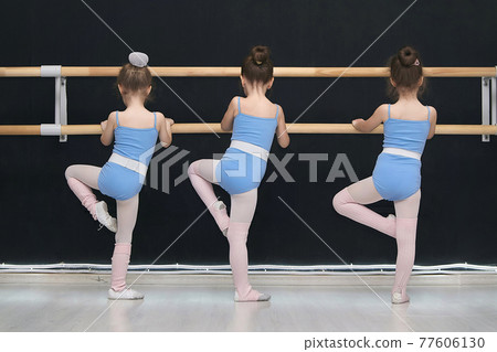 little girls are engaged in the class of a choreographic school 77606130