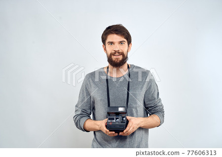 Male photographer professional camera work Studio Technology modern art light background Male photographer professional camera work Studio Technology modern art light background 77606313