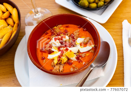 close up of porra antequerana in red bowl for brunch close up of porra antequerana in red bowl for brunch 77607072
