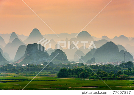 Guilin, China Karst Mountain landscape at Dusk 77607857