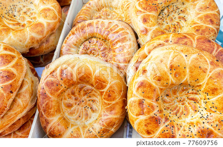 Fresh flat breads with sesame seeds from the tandir Fresh flat breads with sesame seeds from the tandir 77609756