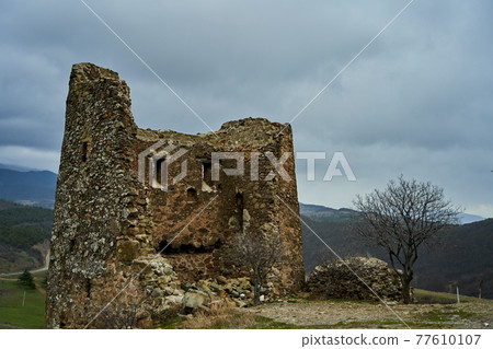 An old stone fortress in the mountains 77610107