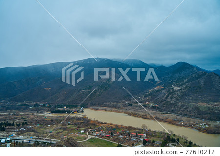 Amazing natural landscape. The confluence of two rivers in the city of Mtskheta in Georgia Amazing natural landscape. The confluence of two rivers in the city of Mtskheta in Georgia 77610212