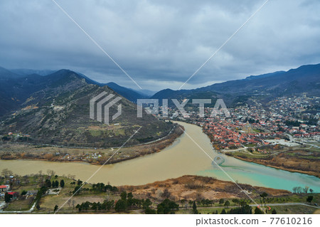 Amazing natural landscape. The confluence of two rivers in the city of Mtskheta in Georgia 77610216