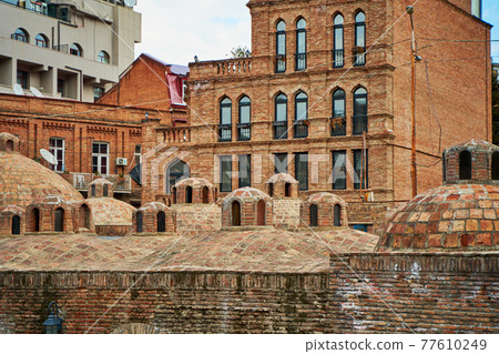 Popular city landmark in Tbilisi. Ancient underground complex of sulfur baths Popular city landmark in Tbilisi. Ancient underground complex of sulfur baths 77610249