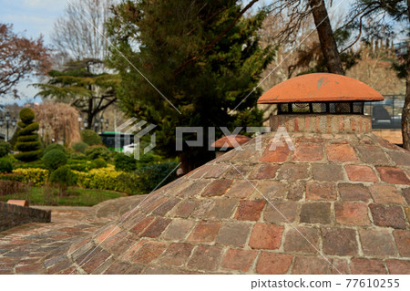 Popular city landmark in Tbilisi. Ancient underground complex of sulfur baths 77610255