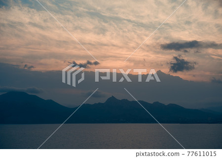 Beautiful natural landscape with mountains, sea and cloudy sky 77611015