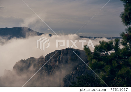 Grand stone pillars on the slopes of Mount Demerdzhi. Valley of ghosts, Crimean Mountains. Grand stone pillars on the slopes of Mount Demerdzhi. Valley of ghosts, Crimean Mountains. 77611017