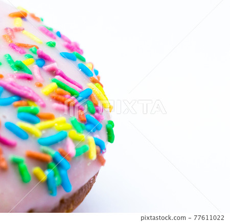 Half a doughnut with powdered sugar colored with a place for text on a white background. Copy space.floating focus Half a doughnut with powdered sugar colored with a place for text on a white background. Copy space.floating focus 77611022