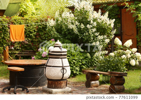 beautiful formal garden with dining place, table tandoor bench beautiful formal garden with dining place, table tandoor bench 77611099