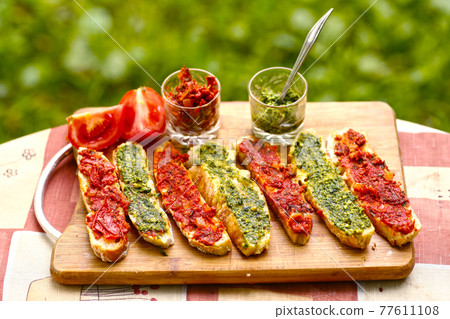hot chili tomato and pesto sauce, sliced roasted italian ciabatta bread for cooking bruschetta sandwiches hot chili tomato and pesto sauce, sliced roasted italian ciabatta bread for cooking bruschetta sandwiches 77611108