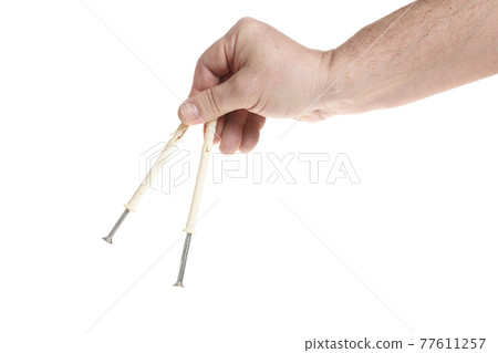 Hand holds metal screws on a white background, a template for designers. Hand holds metal screws on a white background, a template for designers. 77611257