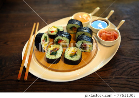 Sushi rolls with soy sauce. roll set sashimi japanese food on wooden background roll set sashimi japanese food on wooden background Sushi rolls with soy sauce. roll set sashimi japanese food on wooden background roll set sashimi japanese food on wooden background 77611305