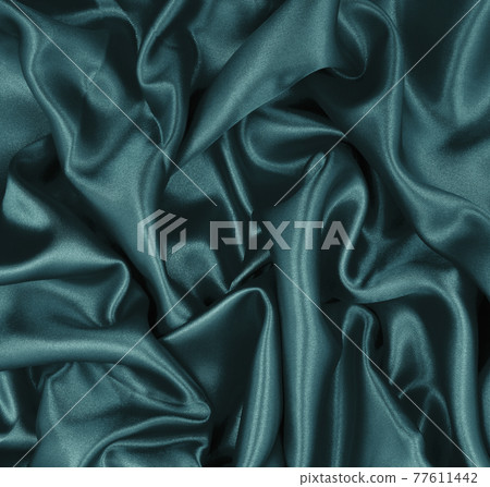 Smooth elegant blue silk or satin luxury cloth texture as abstract background. Luxurious background design 77611442