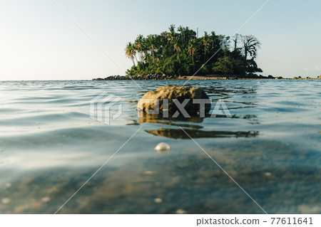 Tiny colorful island with transparent sea. Koh Pling, Phuket Thailand. Tiny colorful island with transparent sea. Koh Pling, Phuket Thailand. 77611641