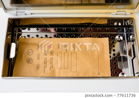 Sterilization of instruments in an autoclave, sterilized tools of a beautician. 77611736