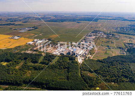 Forest and village in Ukraine, flight over the village of Klevan, view of the love tunnel from above. Forest and village in Ukraine, flight over the village of Klevan, view of the love tunnel from above. 77611763