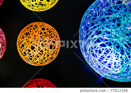 Abstract neon futuristic magic glowing art LED background with wicker shapes multicolored blue, red yellow orange pink purple balls with plastic fiber texture in black space 77612166