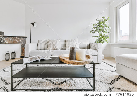 Interior of light living room in apartment 77614050