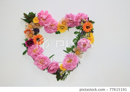 Heart wreath with colorful scented herbs 77615191