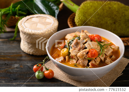Northern Thai food (Kang Kanoon), Spicy young jackfruit soup with pork in a bowl  77615532