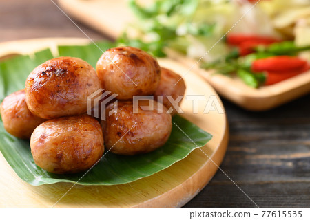 Thai sausage or Isan sausage (grilled fermented rice with minced pork) Thai sausage or Isan sausage (grilled fermented rice with minced pork) 77615535