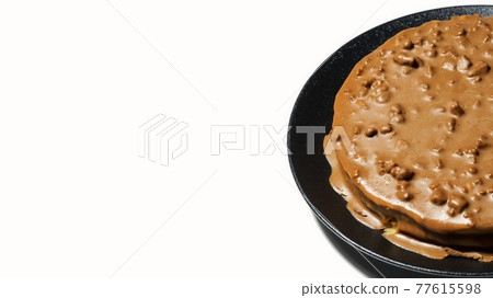 Swedish almond and chocolate cake on a black dessert plate 77615598
