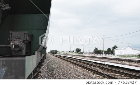 Boxcars in the railway station, railway tracks Boxcars in the railway station, railway tracks 77618427
