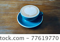 Latte on a wooden table 77619770