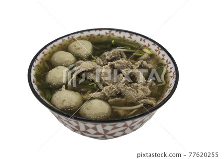 Beef clear soup with sliced beef, meatball and vegetables in bowl isolated on white background with clipping path. 77620255