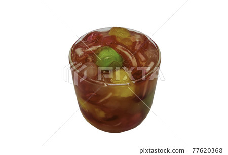 Water chestnut stuffed in pink ruby-like ripe flour with Syrup in glass cup isolated on white background with clipping path. Water chestnut stuffed in pink ruby-like ripe flour with Syrup in glass cup isolated on white background with clipping path. 77620368