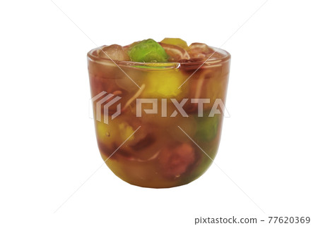 Water chestnut stuffed in pink ruby-like ripe flour with Syrup in glass cup isolated on white background with clipping path. Water chestnut stuffed in pink ruby-like ripe flour with Syrup in glass cup isolated on white background with clipping path. 77620369