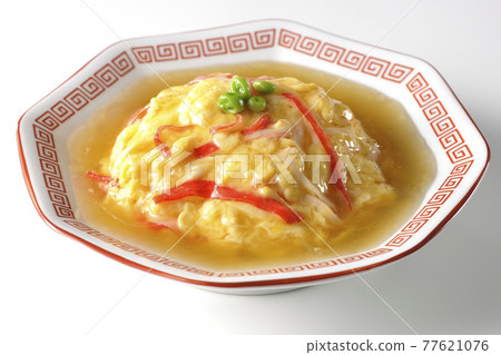 Chinese style omelet rice with red bean paste, Tianjin rice photographed on a white background 77621076