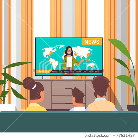 family watching TV daily news program parents with son spending time together living room interior family watching TV daily news program parents with son spending time together living room interior 77621457