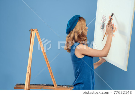 Woman artist tail hand brush drawing art Creative lifestyle blue background Woman artist tail hand brush drawing art Creative lifestyle blue background 77622148