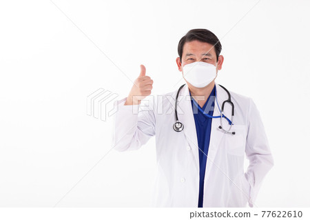 Male doctor mask thumbs up in white coat Male doctor mask thumbs up in white coat 77622610