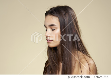 Pretty woman naked shoulders cosmetics clean skin hair care beige background Pretty woman naked shoulders cosmetics clean skin hair care beige background 77624986