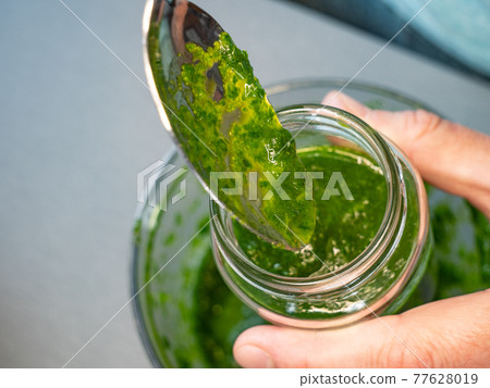 Home made traditional green chimichurri sauce with fresh parsley, wild garlic, 77628019